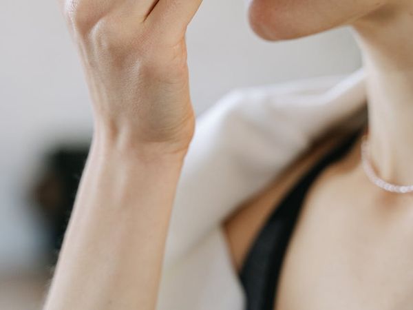 Close-up shot focused on hands during a pose.